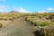 Pathway with amazing landscape with crater volcano La Corona on the background, Lanzarote, Canary Islands