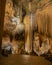 Pathway ends at massive draperies hanging from ceiling to floor at Luray Caverns, Luray, VA