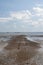 Pathway going out into the sea at Westlcliff, Essex, England, on a summer`s day