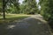 A pathway in Hoftgarten park in Dusseldorf, Germany on a sunny d