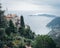 Pathway leads to a stunning ocean view with nearby residential structures in Eze, France