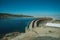 Pathway over dam wall forming a lake on highlands