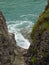 Pathway through rocks leading to sea