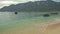 Pathway in Seafront to Sand Beach against Boats in Bay