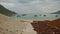 Pathway in Seafront to Sand Beach against Boats in Bay