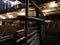 Pathway with silver hand railing and a illuminated Bridge.