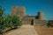 Pathway with trees going to wall and tower at the Marvao Castle