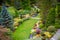 A pathway in a well tended garden, taken with tilt-shift effect.