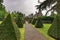 Pathway and yew topiaries with Gwydir Castle