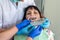 Patient in dentistry comparing teeth with sampler