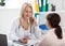 Patient in the doctor`s office, she is receiving a prescription medicine