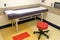 Patient exam table in medical exam room