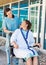 Patient Looking At Friendly Nurse While Sitting On