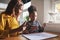 Patient mom teaching daughter schoolwork