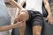 Patient at the physiotherapy doing physical exercises with his therapist