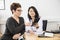 Patient Pointing At Digital Tablet Held By Doctor