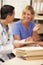 Patient Records On Desk At Nurses Station