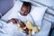 Patient sleeping with teddy bear on the bed at hospital