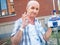 Patient undergoing chemo treatment shows gesture okay