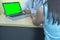 Patients consult doctor in hospital or clinic about sick, with doctor point finger to laptop computer green screen,concept of