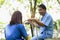 Patients Receive Encouragement and Good Treatment from Caregivers While Sitting Relaxed in The Green Park. Traits of a Quality