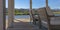 Patio overlooking lake and homes on a sunny day