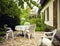 Patio with table and seats and garden view