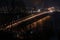 Paton bridge in Kyiv Ukraine at night with nice headlight lines
