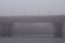 Paton Bridge in rich fog, mist background. Winter morning view. Kyiv, Ukraine