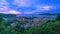 Patong city in phuket thailand beautiful sunset sky with green leaves frame in the foreground