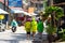 Patong, Phuket, Thailand - Songkran Festival. Tourists in special colored water-protective cloaks walk down the street