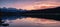 Patricia lake with mountain range reflection colorful sky at sunset at Jasper national park