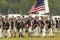 Patriot soldiers march to Surrender Field as part of the 225th Anniversary of the Victory at Yorktown, a reenactment of the siege