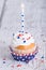 Patriotic 4th of July cupcake with candle