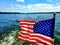 Patriotic American Flag on 4th of July on a boat in the lake or ocean  during the summer