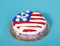 Patriotic American flag cake on blue