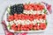 Patriotic American flag salad with blueberry, watermelon and feta