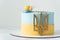 Patriotic cake with yellow and blue cream cheese frosting decorated with the state coat of arms of Ukraine. Independence Day Cake.