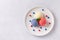 Patriotic colors ice cream scoops on white plate, top view