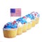Patriotic cupcakes decorated with American Flag and blue, white cream with red stars sprinkles on the top, isolated