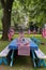 a patriotic decorated picnic table in a park