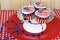Patriotic flag cupcakes on pedestal