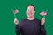 Patriotic man waving two American flags excited happy facial expression on green screen background