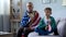 Patriotic old man holding American flag, listening national anthem with grandson