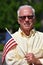 Patriotic Retired Man With Usa Flag In Summer