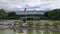 Patriotic Scene: American Flag Waving in Front of Corporate Office Building. Proudly Displayed Flag in Business Center