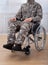 Patriotic Soldier Sitting On Wheel Chair