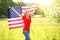 Patriotic young woman with American flag