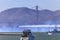 Patriots Jet Team aerobatic team's Aero L-39 Albatros jet flying under the Golden Gate Bridge in San Francisco, USA