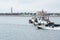 Patrol boat and two tugs